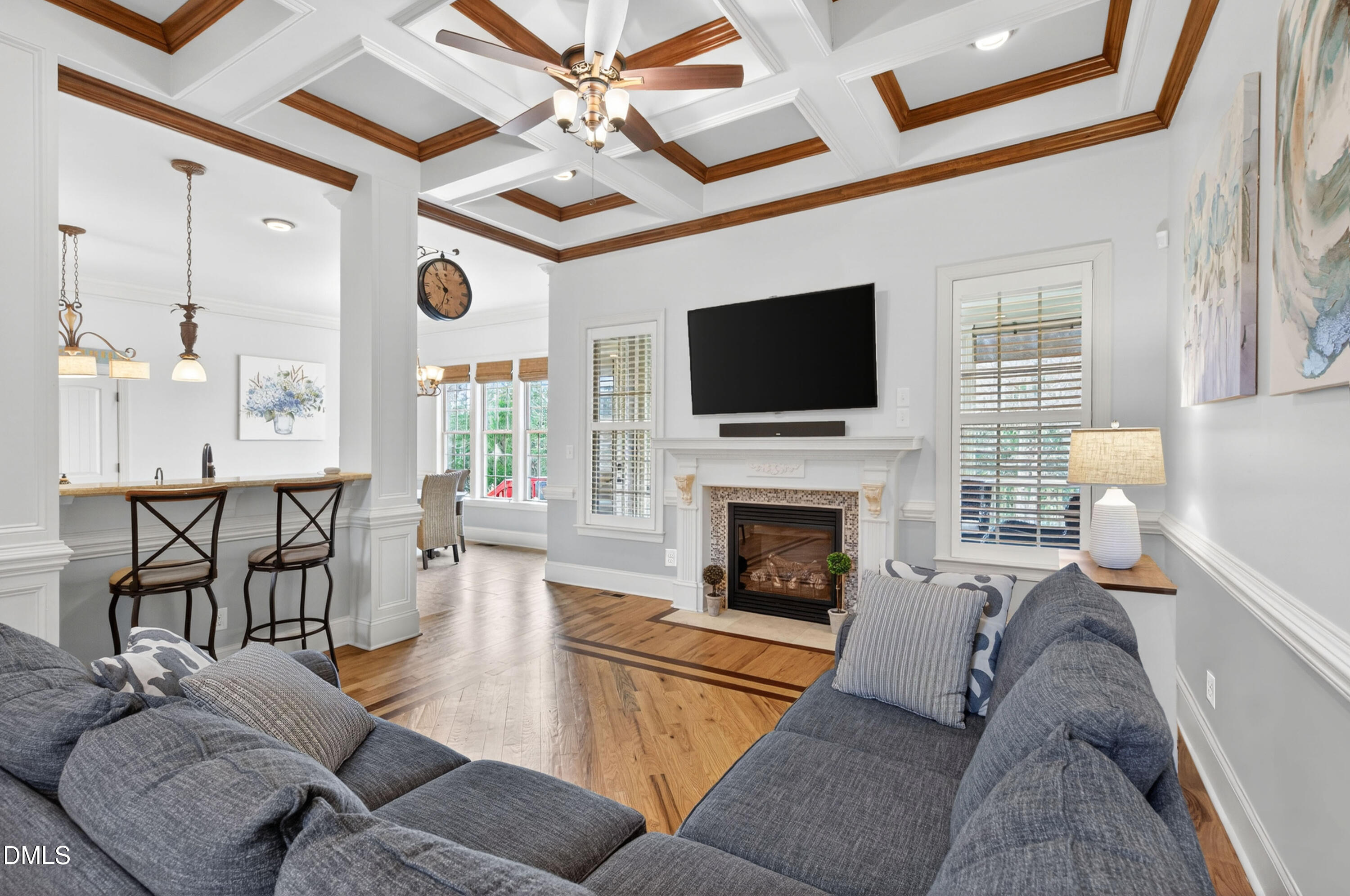 691 Hawthorne Place Creedmoor, NC 27522 - Photo 12 of 84 a living room with furniture a flat screen tv and a fireplace