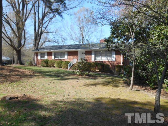6591 Dwight Rowland Road Willow Spring, NC 27592 - Photo 1 of 16 a view of a house with a yard