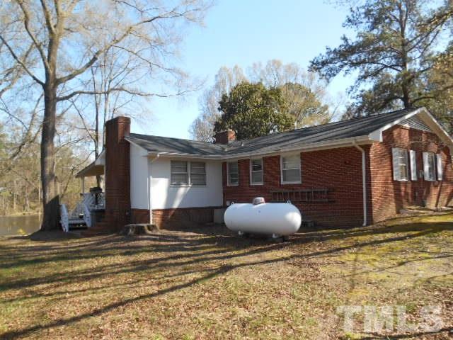 6591 Dwight Rowland Road Willow Spring, NC 27592 - Photo 8 of 16 a front view of a house with garden