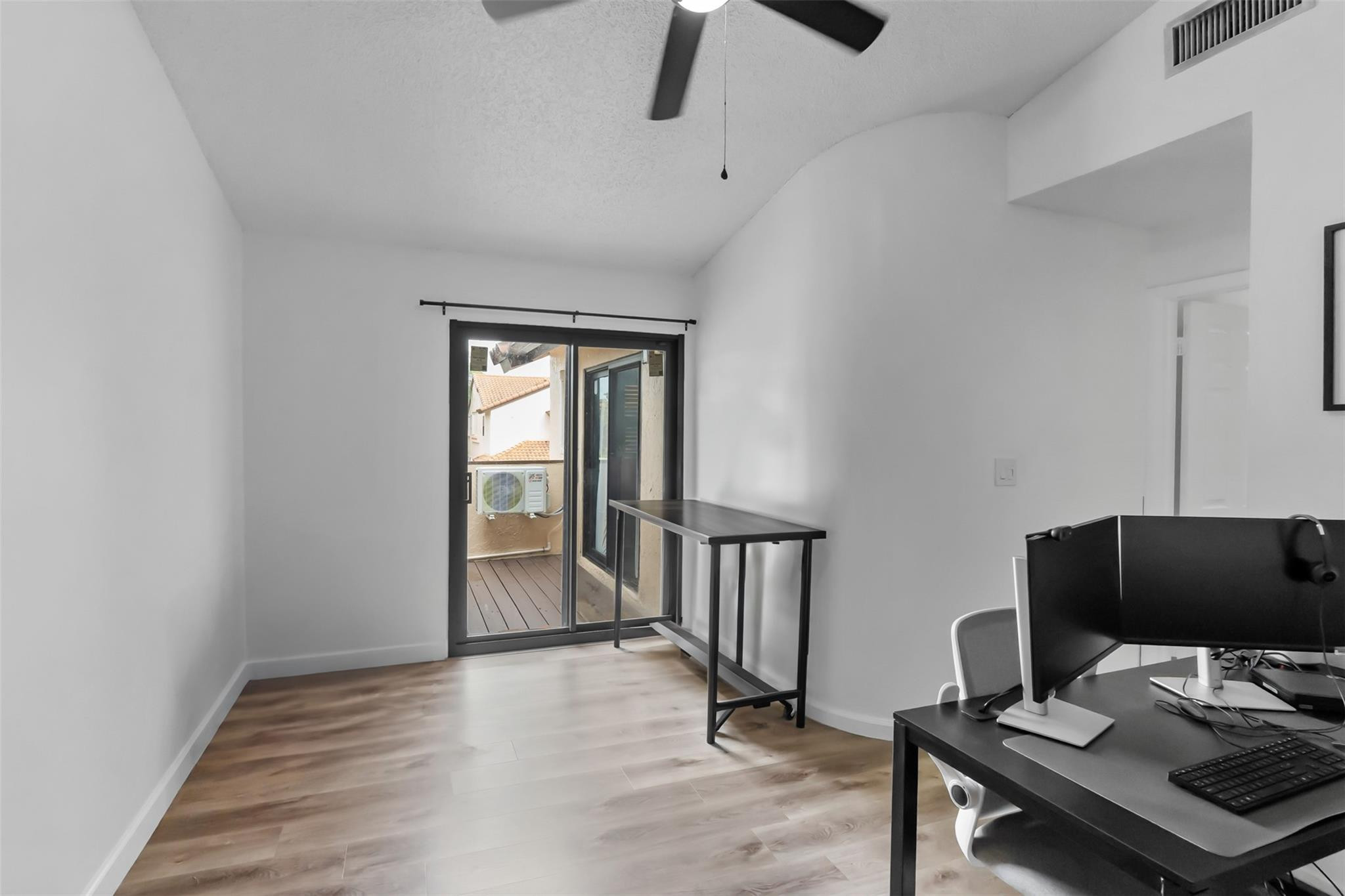 13278 Southwest 114th Terrace, Unit 13278 Miami, FL 33186 - Photo 13 of 35 a view of a workspace with furniture and a window