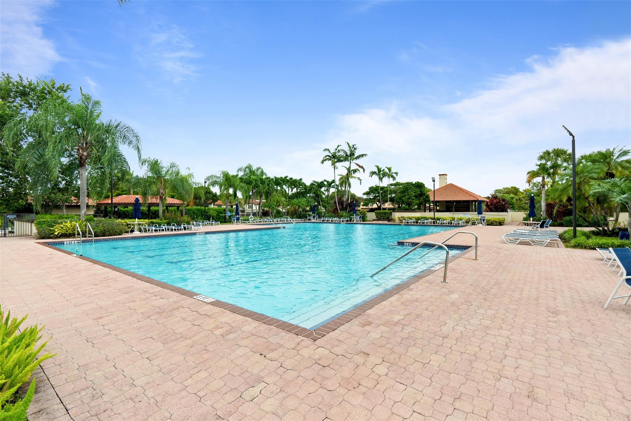 13278 Southwest 114th Terrace, Unit 13278 Miami, FL 33186 - Photo 19 of 35 a view of a swimming pool and a yard