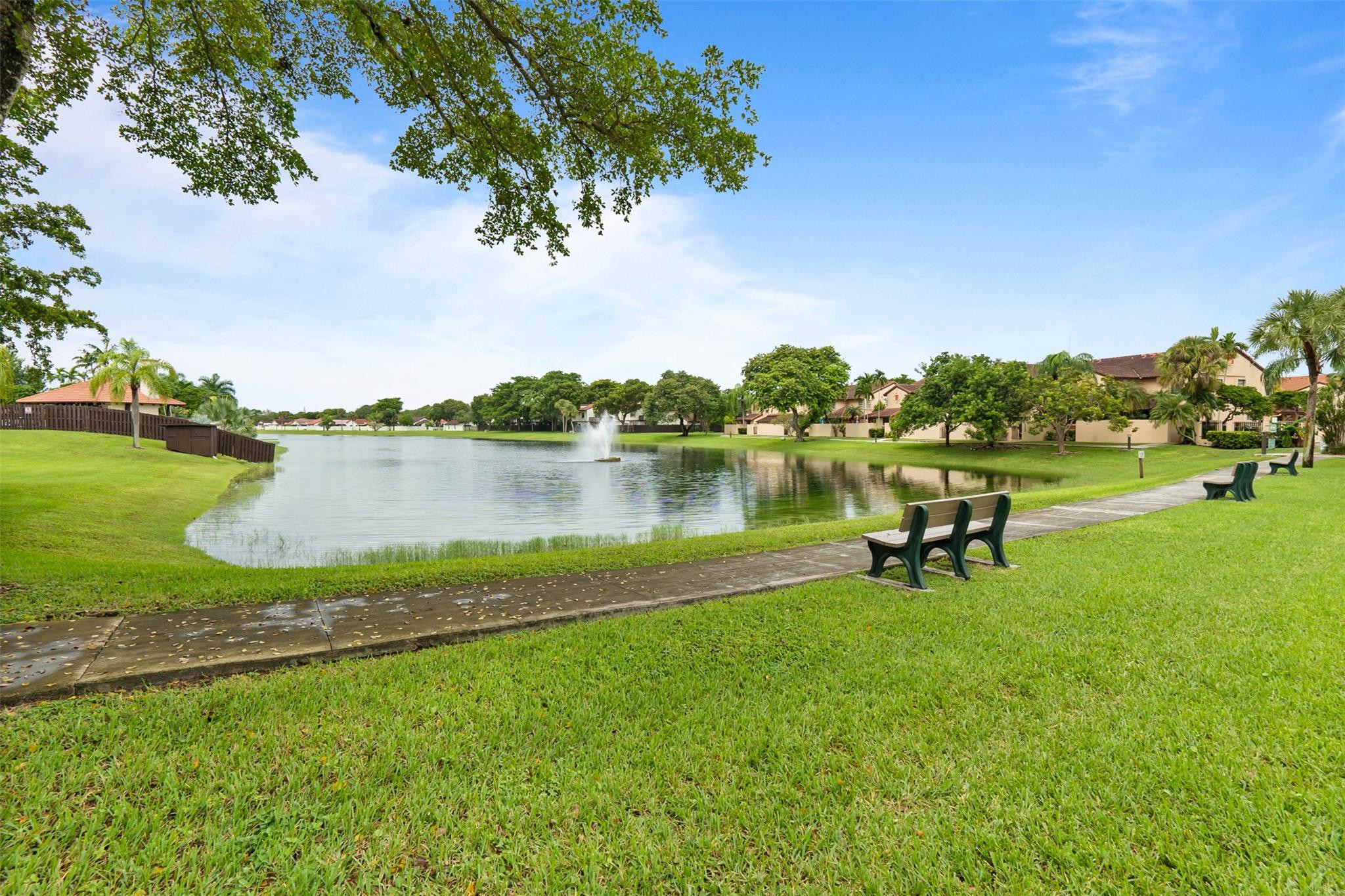 13278 Southwest 114th Terrace, Unit 13278 Miami, FL 33186 - Photo 20 of 35 a garden with wooden fence and trees