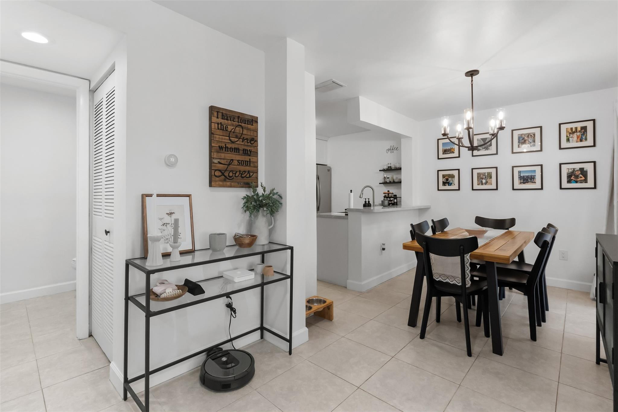 13278 Southwest 114th Terrace, Unit 13278 Miami, FL 33186 - Photo 2 of 35 a view of a dining room with furniture and chandelier