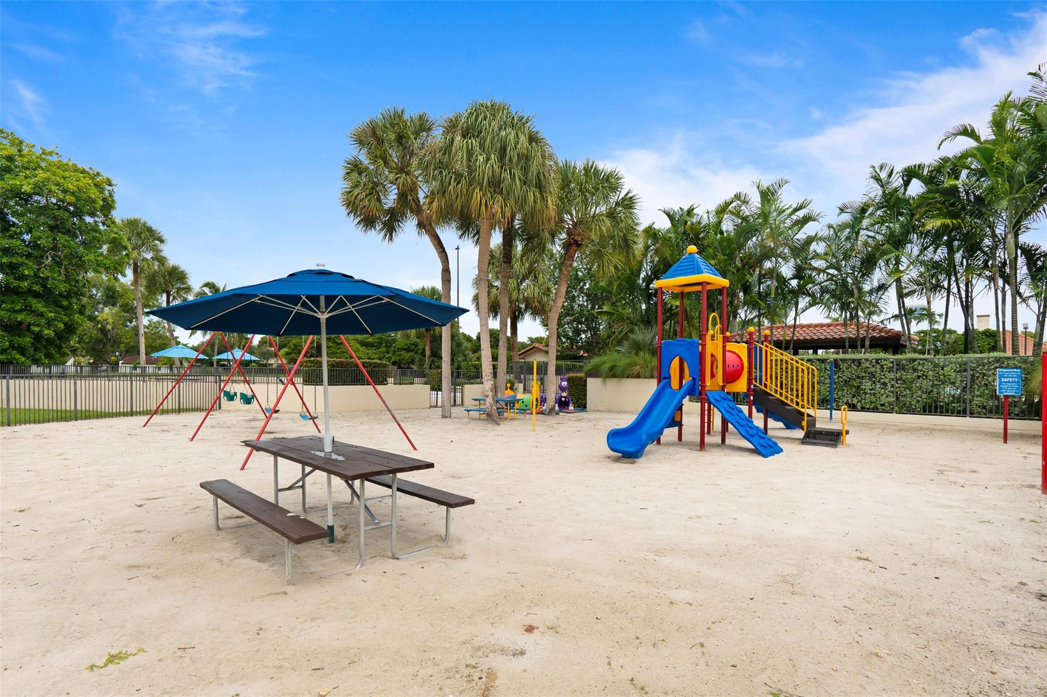 13278 Southwest 114th Terrace, Unit 13278 Miami, FL 33186 - Photo 25 of 35 a view of park with slide and potted plants