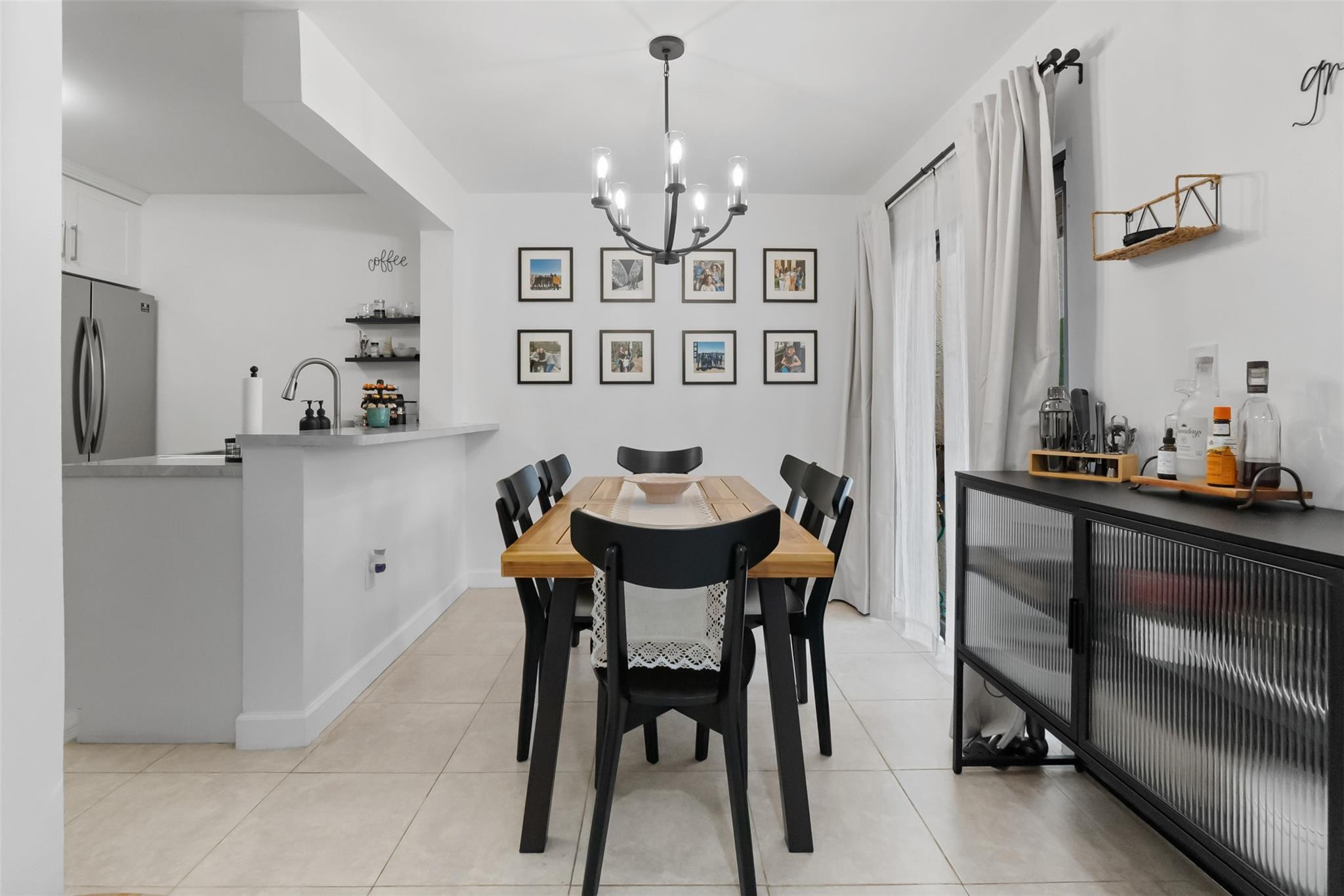 13278 Southwest 114th Terrace, Unit 13278 Miami, FL 33186 - Photo 3 of 35 a view of a dining room with furniture and a chandelier