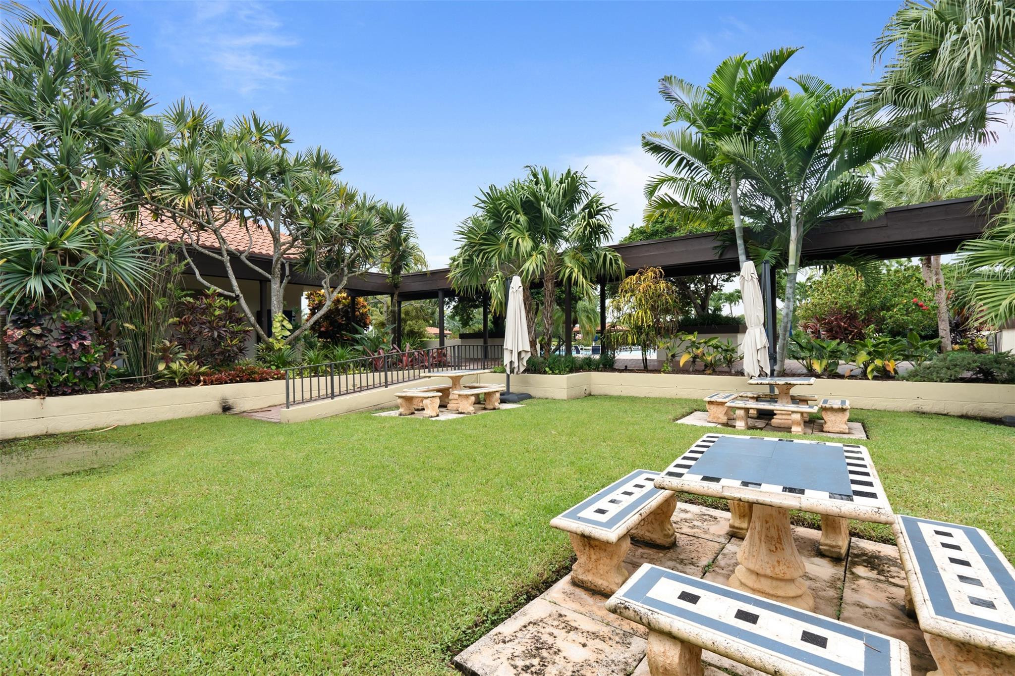 13278 Southwest 114th Terrace, Unit 13278 Miami, FL 33186 - Photo 33 of 35 a view of a swimming pool with a patio