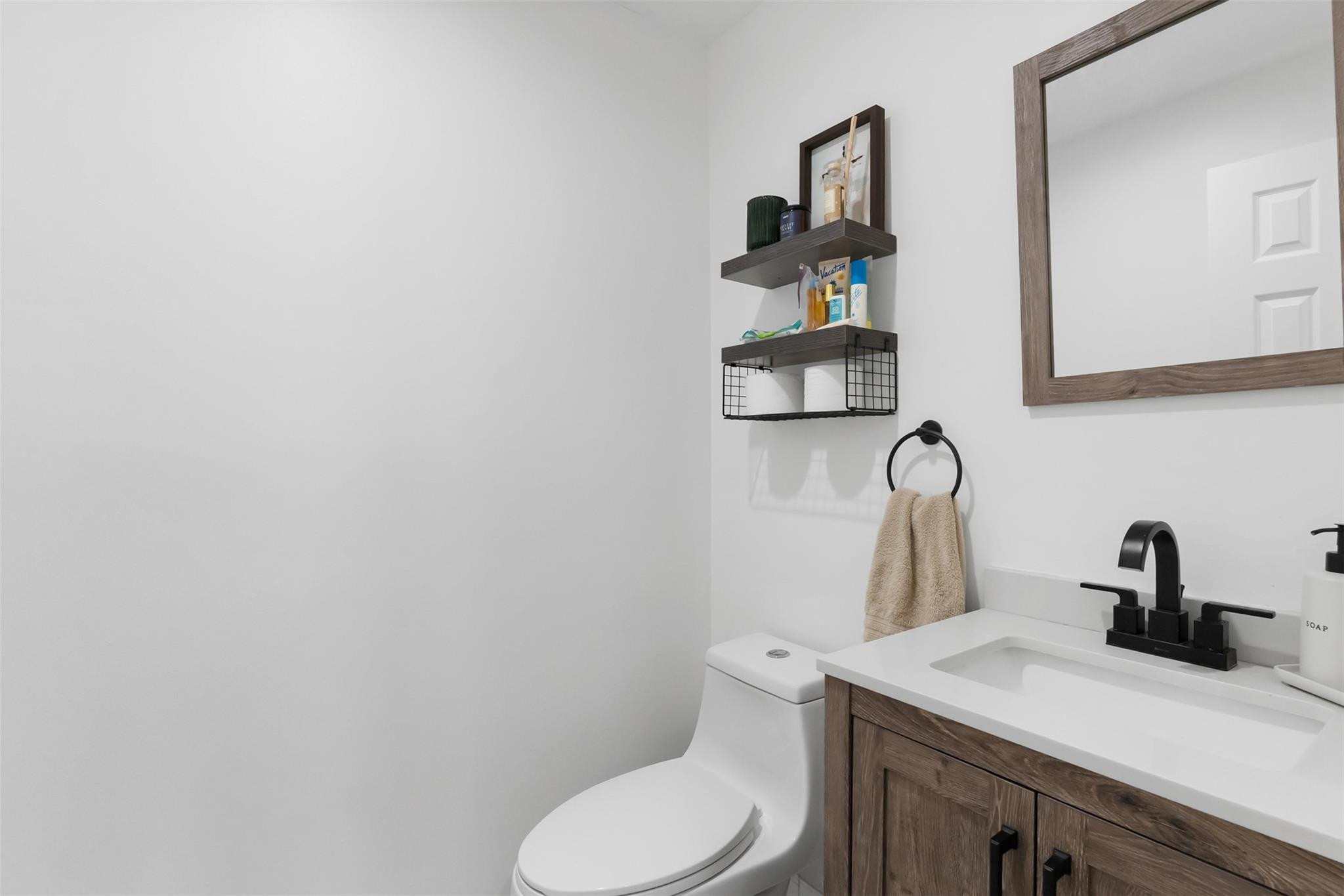 13278 Southwest 114th Terrace, Unit 13278 Miami, FL 33186 - Photo 6 of 35 a bathroom with a toilet sink and mirror