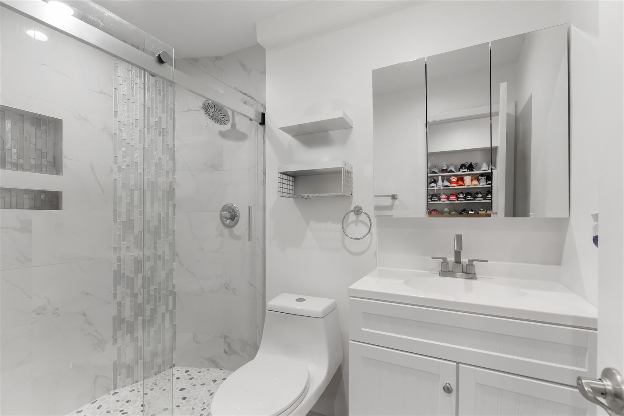 13278 Southwest 114th Terrace, Unit 13278 Miami, FL 33186 - Photo 10 of 35 a bathroom with a sink toilet and shower