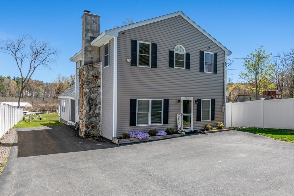 651 Nashua Road Dracut, MA 01826 - Photo 1 of 42 front view of house with a yard