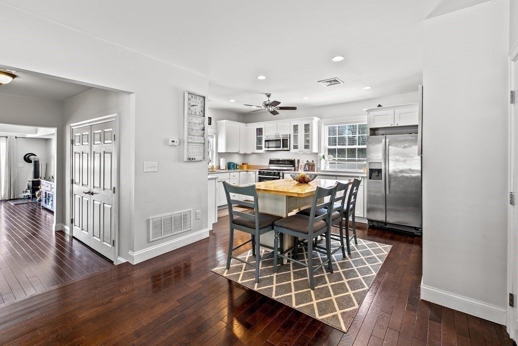 651 Nashua Road Dracut, MA 01826 - Photo 11 of 42 a view of a dining room with furniture and wooden floor