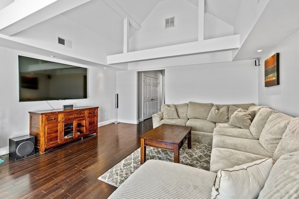 651 Nashua Road Dracut, MA 01826 - Photo 15 of 42 a living room with furniture and a flat screen tv