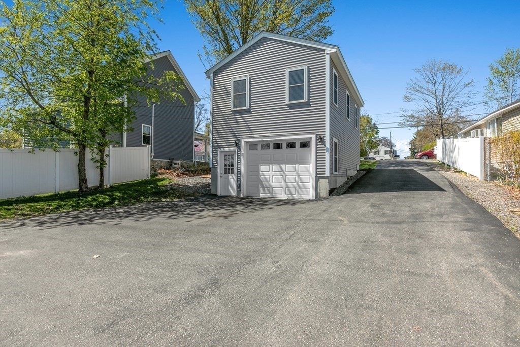 651 Nashua Road Dracut, MA 01826 - Photo 2 of 42 a view of a house with a yard