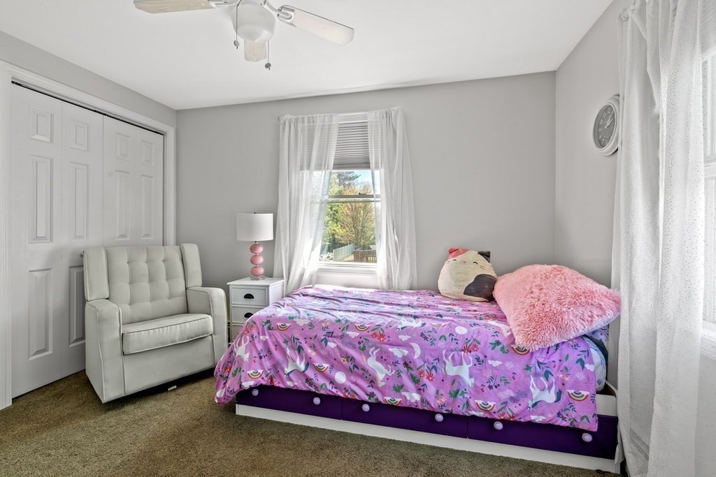 651 Nashua Road Dracut, MA 01826 - Photo 22 of 42 a bedroom with a bed and a window
