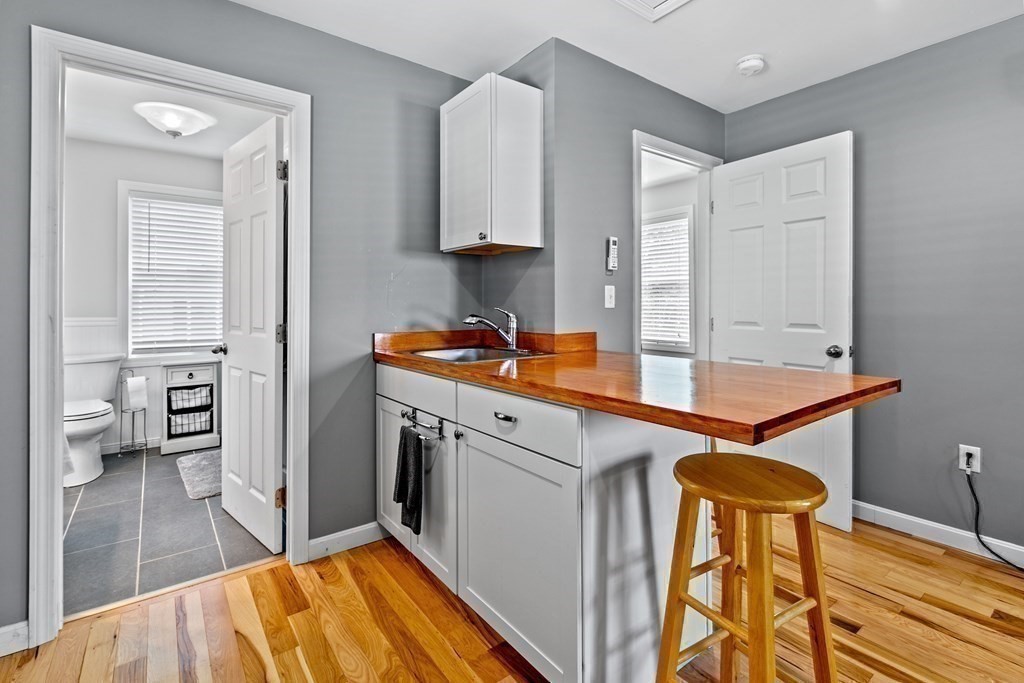 651 Nashua Road Dracut, MA 01826 - Photo 35 of 42 a kitchen with stainless steel appliances granite countertop a sink and a refrigerator