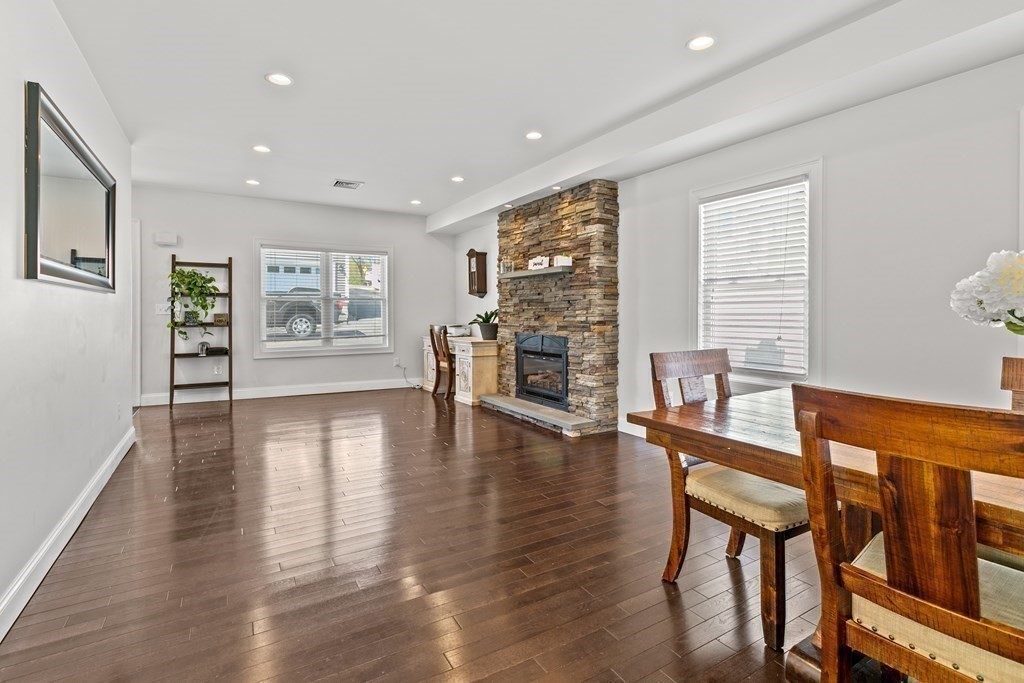 651 Nashua Road Dracut, MA 01826 - Photo 4 of 42 a view of a livingroom with furniture wooden floor and windows