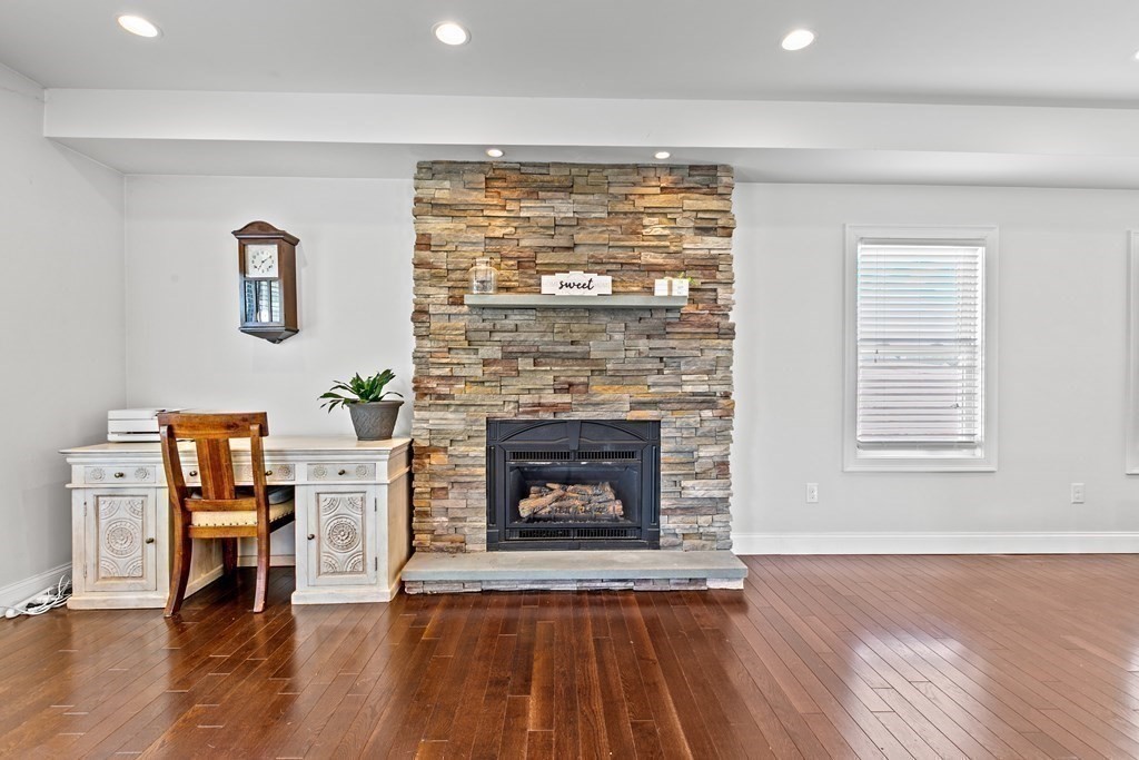 651 Nashua Road Dracut, MA 01826 - Photo 6 of 42 a living room with furniture and a fireplace