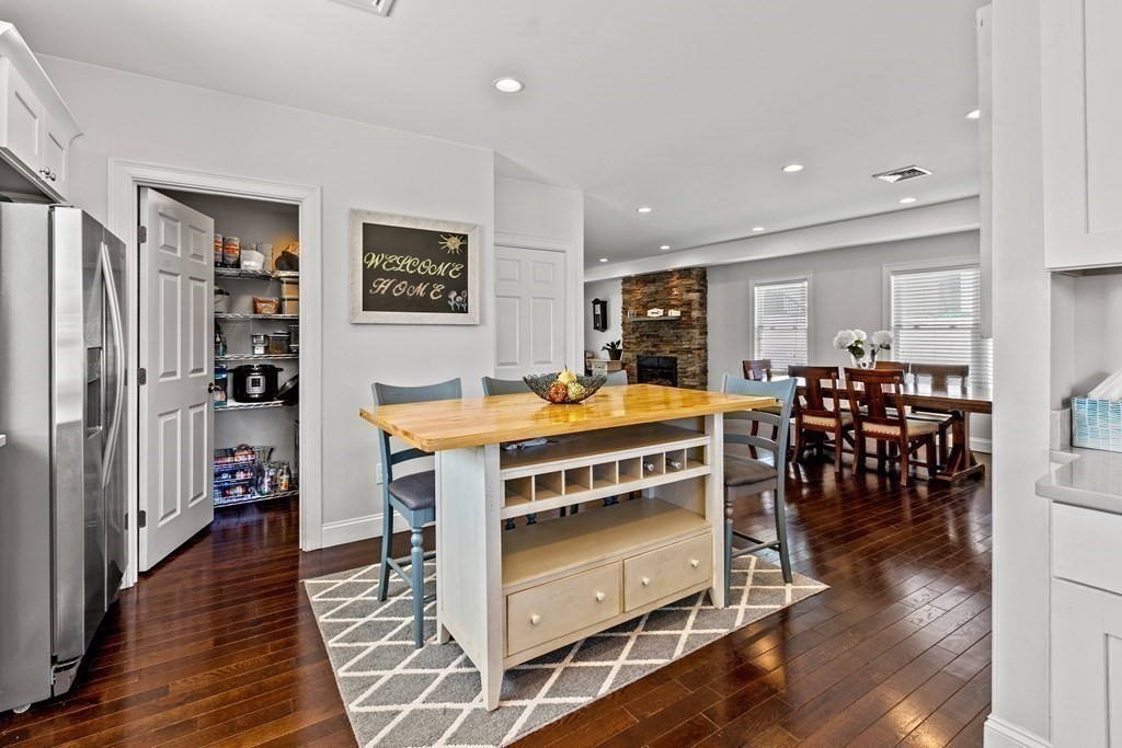 651 Nashua Road Dracut, MA 01826 - Photo 8 of 42 a view of a dining room with furniture and wooden floor