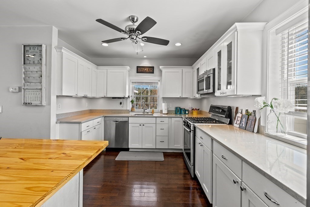 651 Nashua Road Dracut, MA 01826 - Photo 10 of 42 a kitchen with stainless steel appliances granite countertop a sink and cabinets