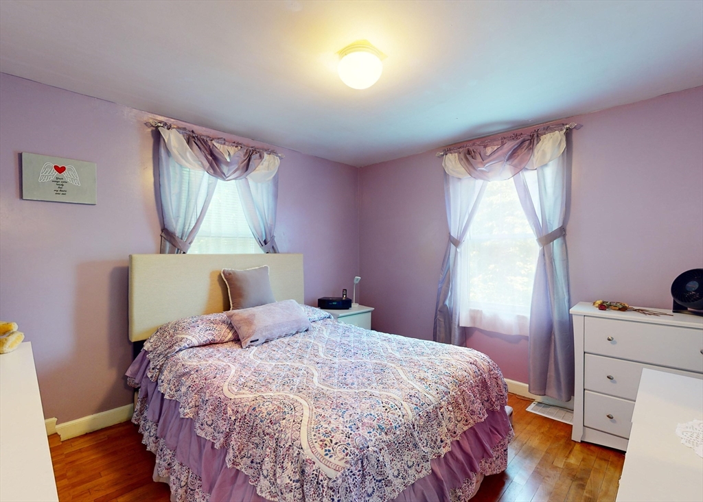 1205 Trapelo Road Waltham, MA 02451 - Photo 11 of 25 a bedroom with a bed and a mirror