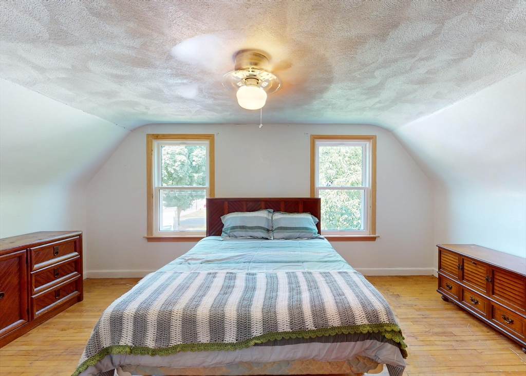 1205 Trapelo Road Waltham, MA 02451 - Photo 12 of 25 a bedroom with a bed and a window