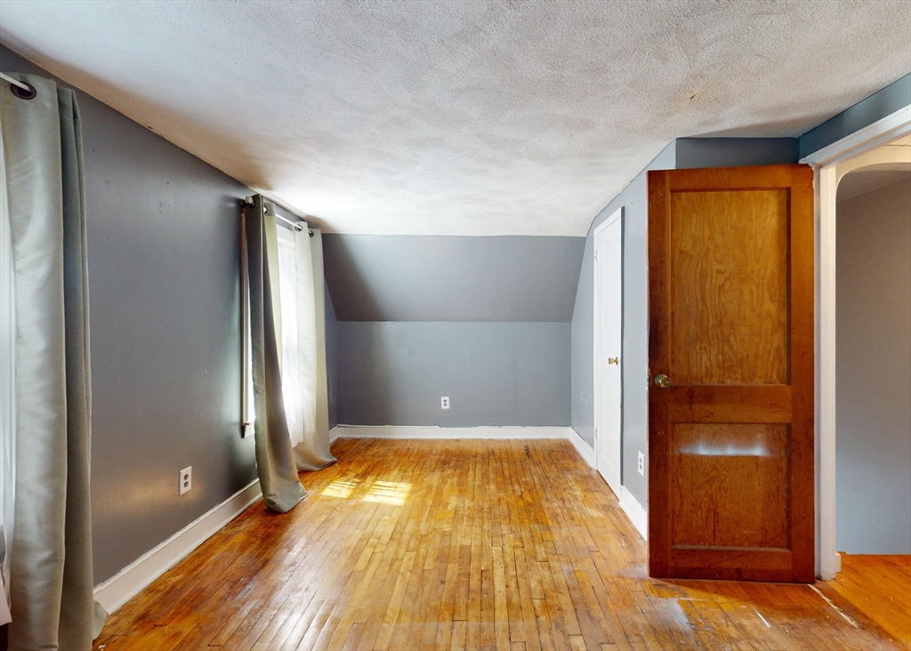 1205 Trapelo Road Waltham, MA 02451 - Photo 14 of 25 a view of empty room with wooden floor