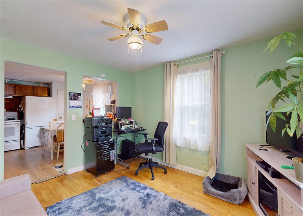 1205 Trapelo Road Waltham, MA 02451 - Photo 7 of 25 a view of a workspace with furniture and a livingroom