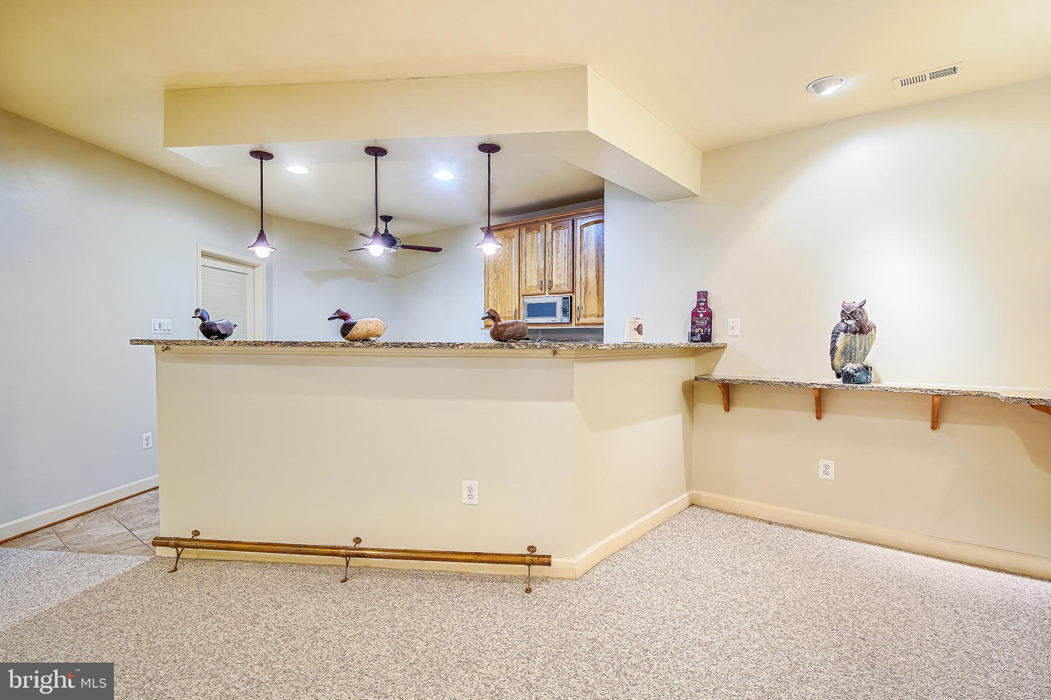 6661 South Clifton Road Frederick, MD 21703 - Photo 44 of 68 View from the recreation room to the wet bar
