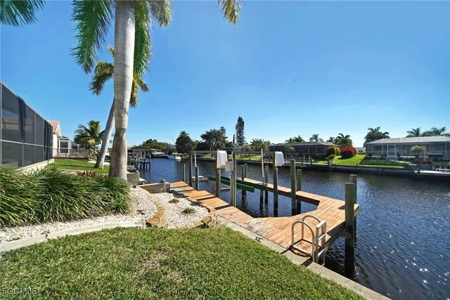 an aerial view of a house with a lake view