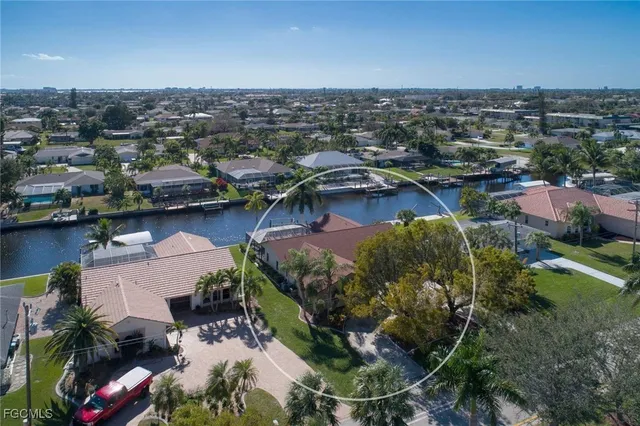 an aerial view of a house with outdoor space lake view and boat