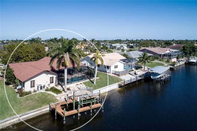 an aerial view of a house with a ocean view
