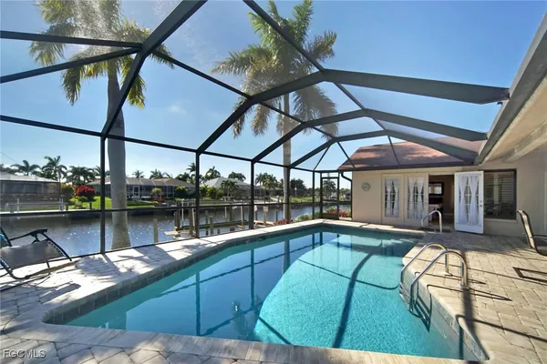 a view of a swimming pool with a patio