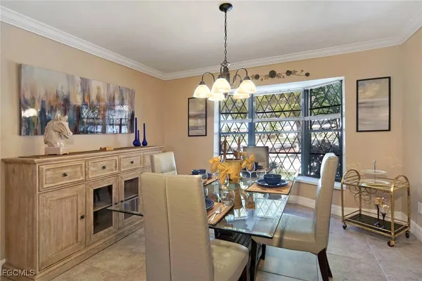 a view of a dining room with furniture window and outside view