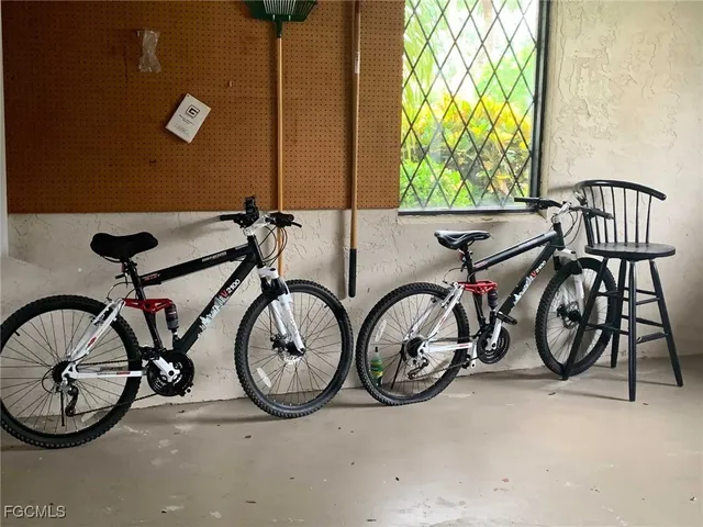 a view of an bike storage with a small yard