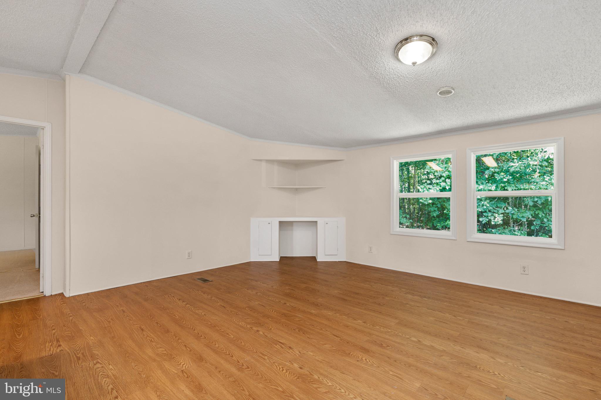 185 Deane Road Louisa, VA 23093 - Photo 18 of 42 a view of an empty room with a window