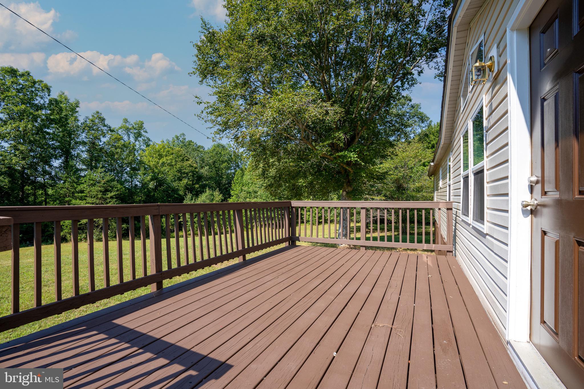 185 Deane Road Louisa, VA 23093 - Photo 10 of 42 a view of balcony with wooden floor and fence