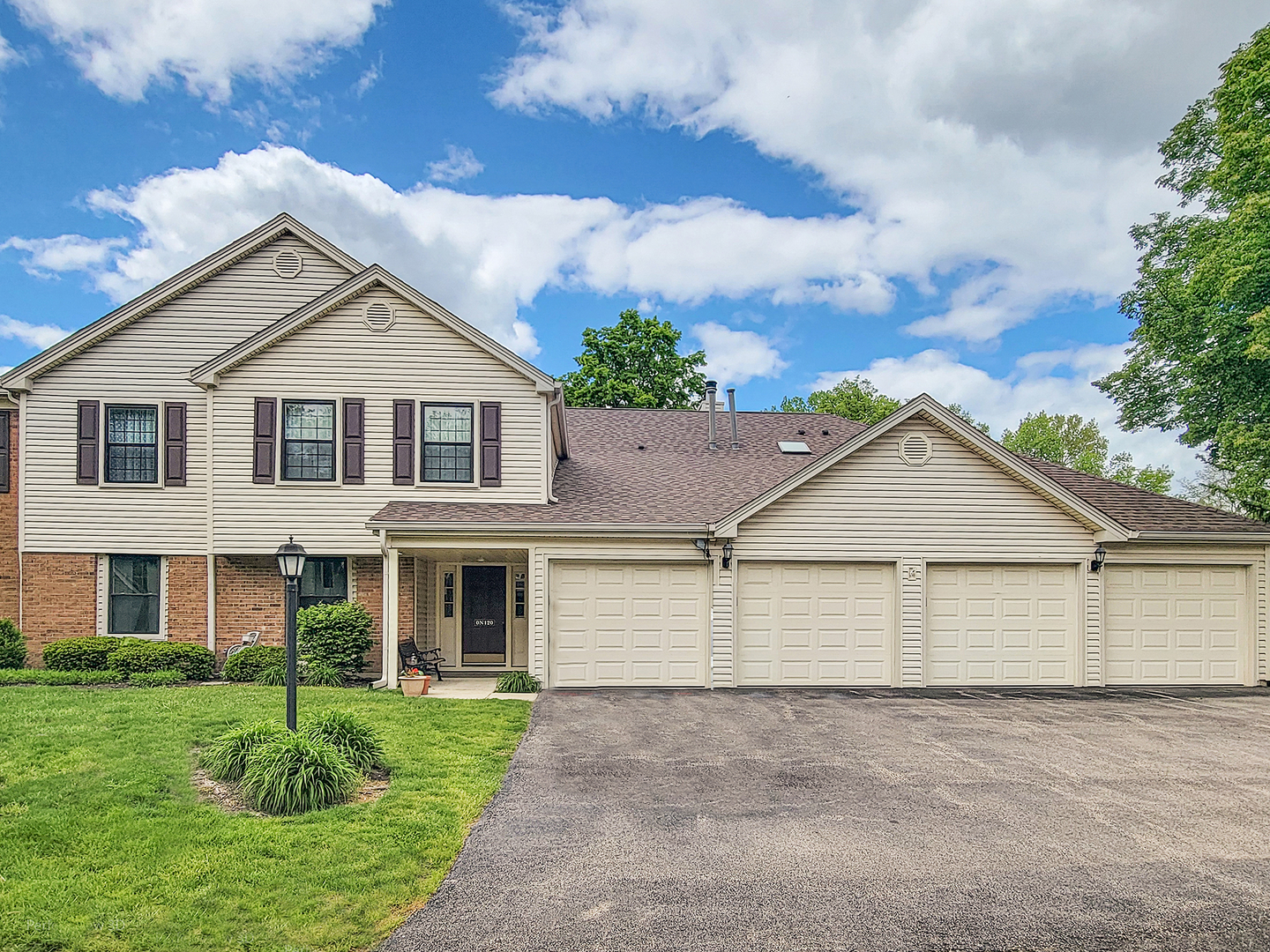 -n120 Windermere Road, Unit 2008 Winfield, IL 60190 - Photo 1 of 23 front view of a house with a yard