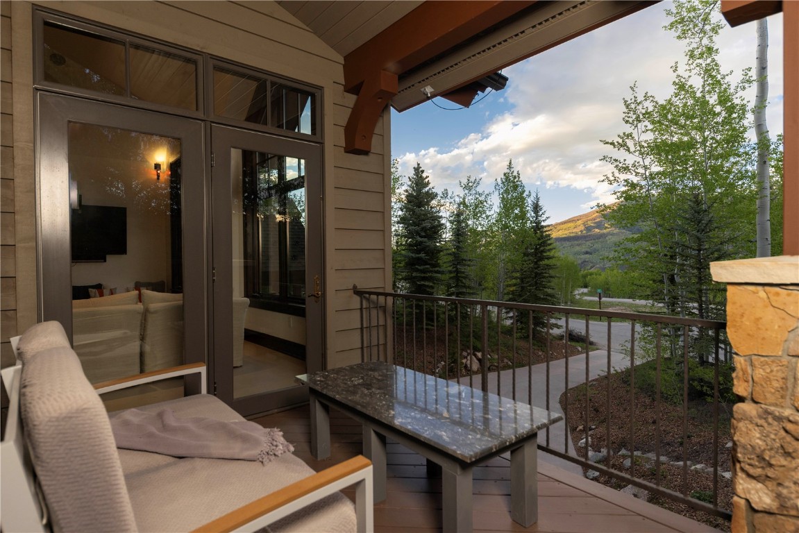 525 Two Cabins Drive Silverthorne, CO 80498 - Photo 13 of 35 a balcony with table and chairs