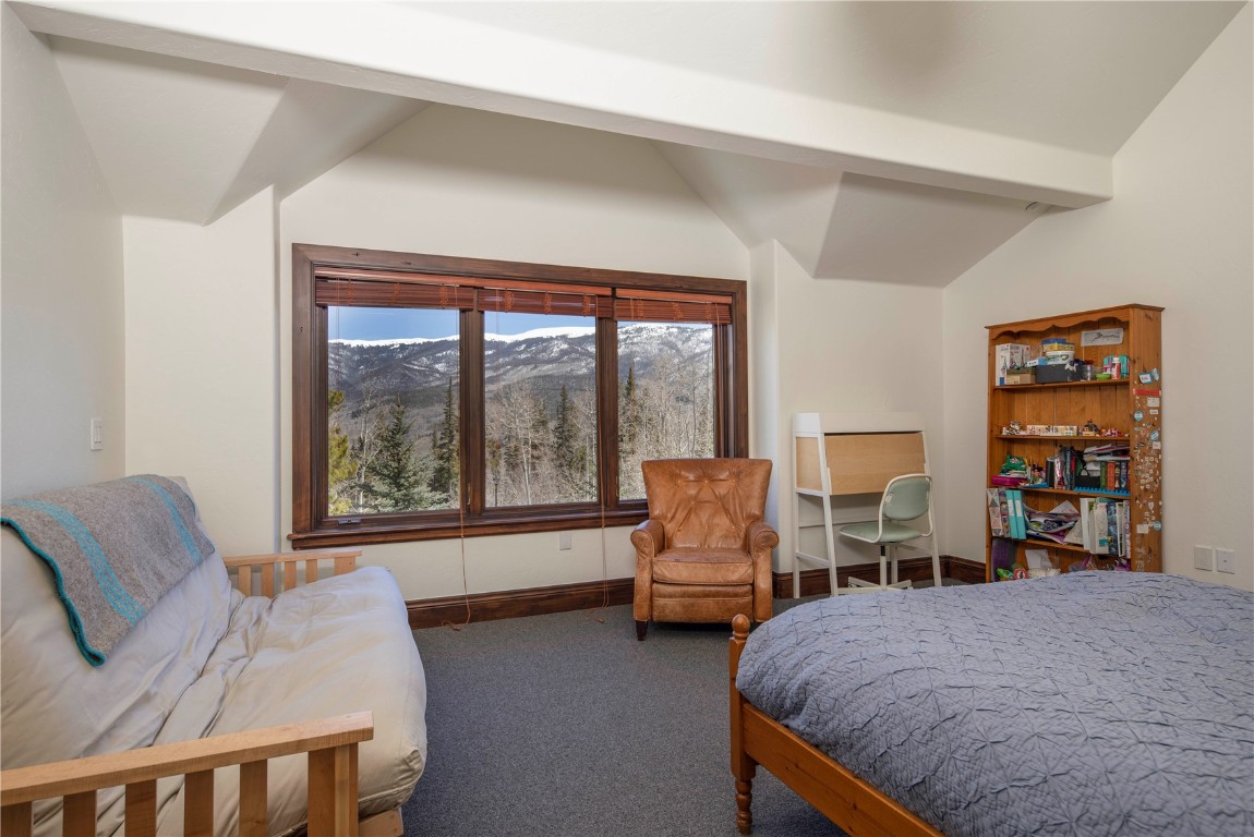 525 Two Cabins Drive Silverthorne, CO 80498 - Photo 23 of 35 a living room with furniture and a large window