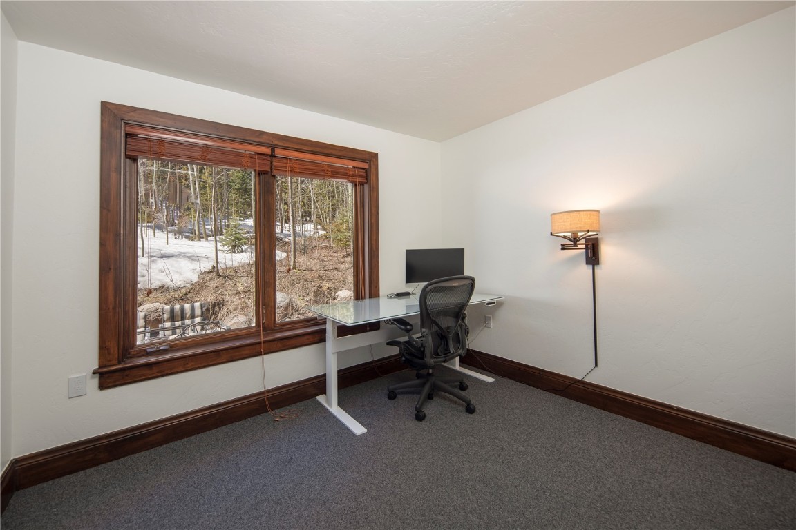 525 Two Cabins Drive Silverthorne, CO 80498 - Photo 27 of 35 a view of a workspace with furniture and a window