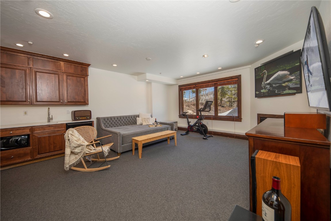 525 Two Cabins Drive Silverthorne, CO 80498 - Photo 30 of 35 a living room with furniture and a window