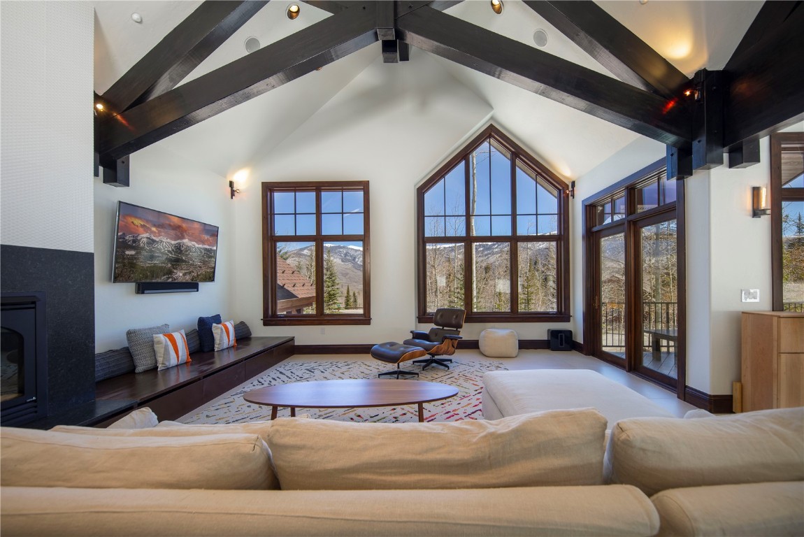 525 Two Cabins Drive Silverthorne, CO 80498 - Photo 10 of 35 a living room with furniture and a flat screen tv