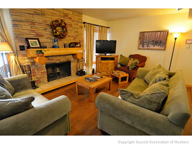 373 Wild Irishman Road, Unit 1076 Keystone, CO 80435 - Photo 11 of 25 Living Room. Great wood burning fireplace, for that authentic mountain feel.