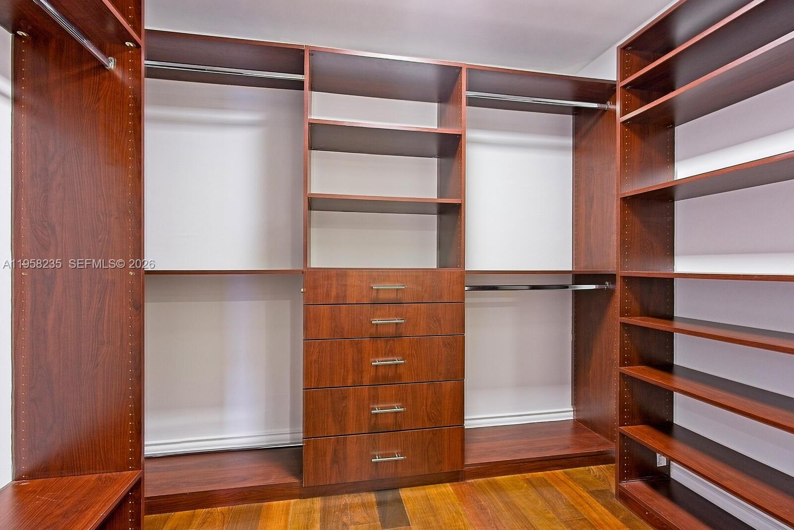 1925 Brickell Avenue, Unit D1201 Miami, FL 33129 - Photo 12 of 27 a view of walk in closet with empty racks
