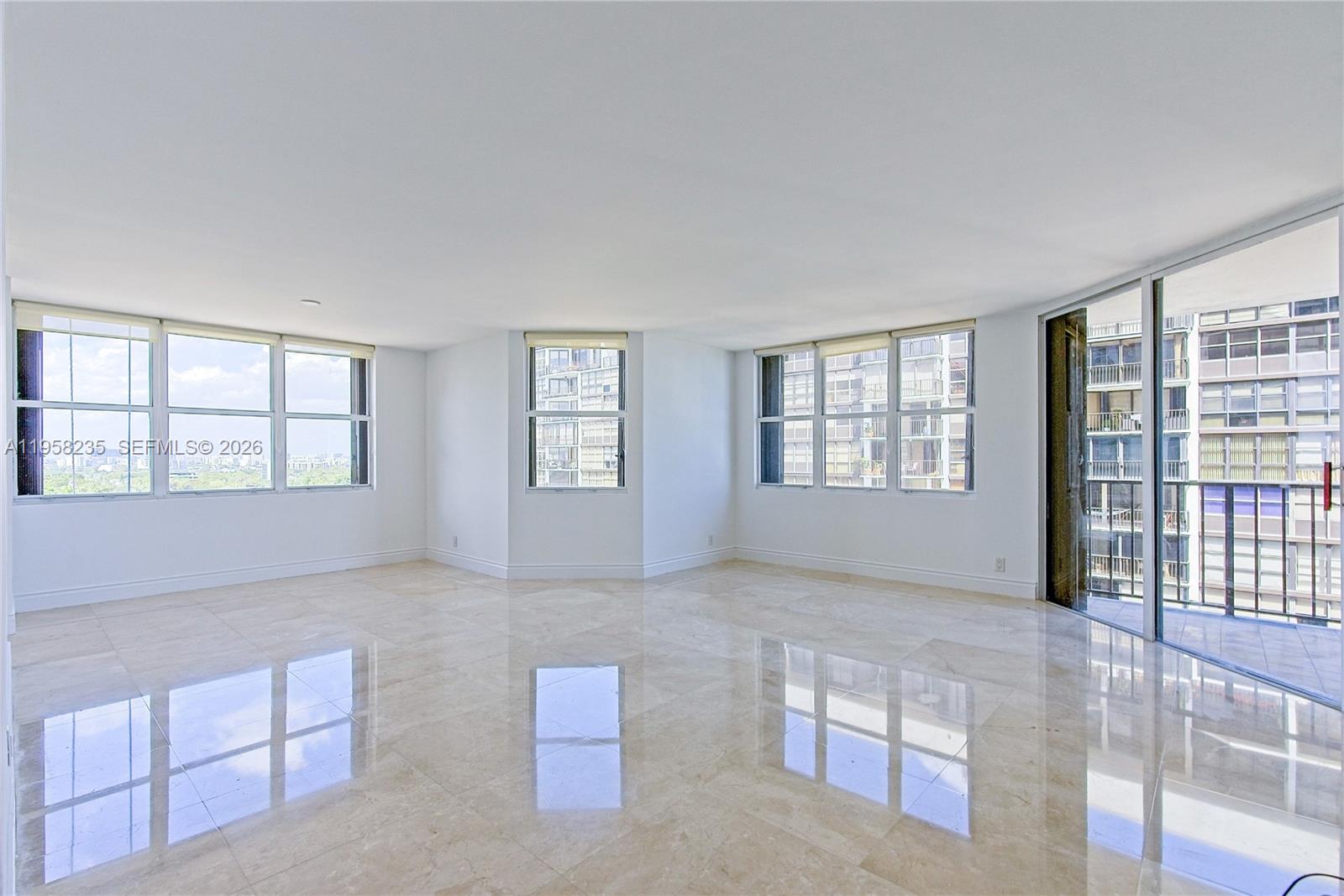 1925 Brickell Avenue, Unit D1201 Miami, FL 33129 - Photo 3 of 27 an empty room with windows