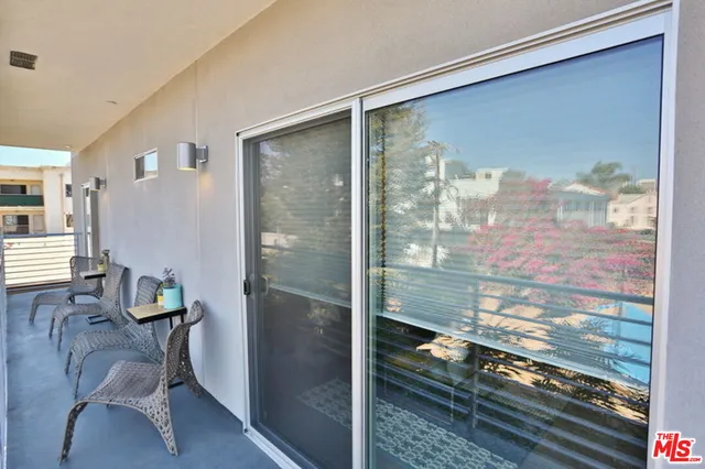 a view of a glass door with a balcony