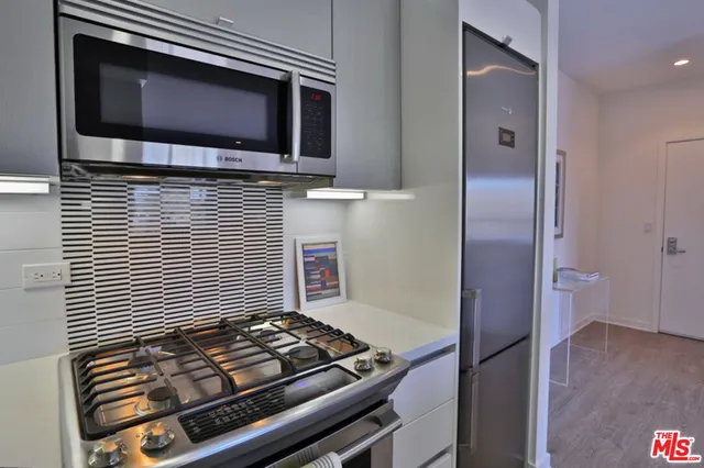 a kitchen with a stove and a microwave