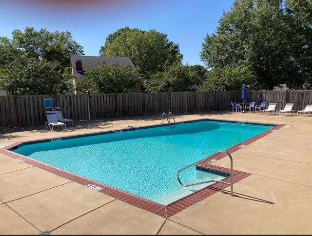 6976 Country Road, Unit 34 Germantown, TN 38138 - Photo 25 of 25 a view of a backyard with swimming pool and wooden fence