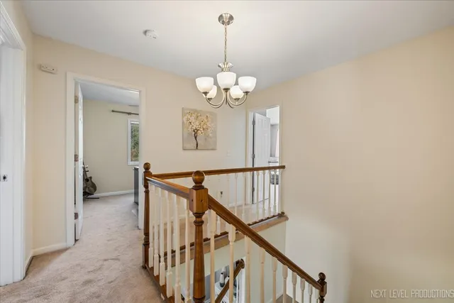 a view of a chandelier and wooden floor