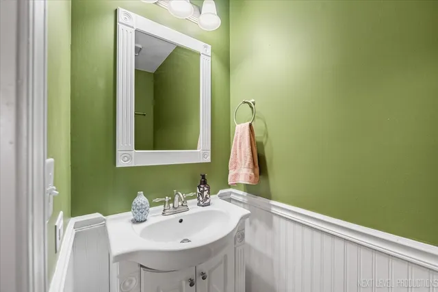a view of a deck with wooden floor and fence