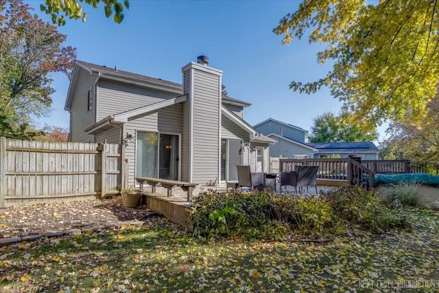 a view of a house with furniture and garden